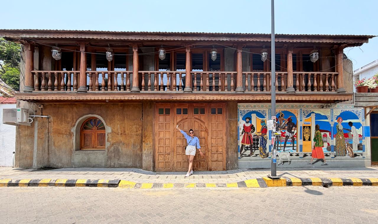 Disha in front of a Portuguese-era building in Goa